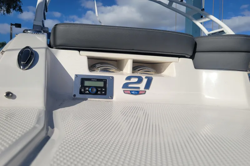 Slide: The Image of 2025 Chaparral 21 SSi OB boat interior with audio system and seating. - 8