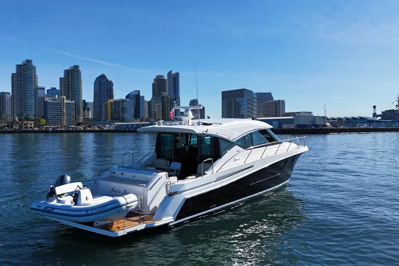 The Image of 2016 Tiara Yachts 50 Coupe on water with city skyline backdrop. - 0