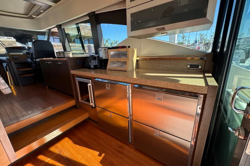 Slide: The Image of Luxurious interior of 2016 Tiara Yachts 50 Coupe with modern kitchen amenities. - 16