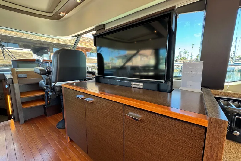 Slide: The Image of Interior of 2016 Tiara Yachts 50 Coupe with TV and helm station. - 17