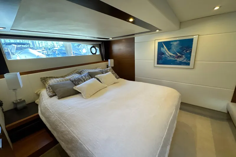 Slide: The Image of Luxurious bedroom interior of 2016 Tiara Yachts 50 Coupe with elegant decor and artwork. - 26