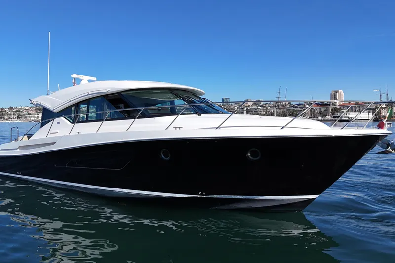 Slide: The Image of 2016 Tiara Yachts 50 Coupe on water, sleek design, sunny day. - 3