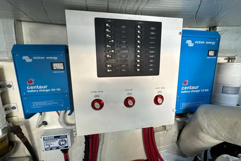 Slide: The Image of Electrical panel with Victron Energy battery chargers on a 2016 Tiara Yachts 50 Coupe. - 33