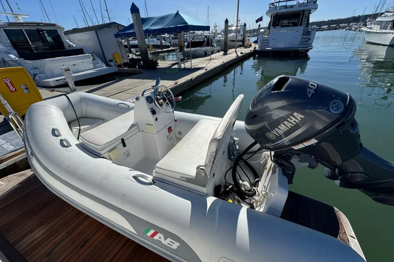 Slide: The Image of Inflatable boat with Yamaha 40 engine docked near Tiara Yachts 50 Coupe, 2016 model. - 35