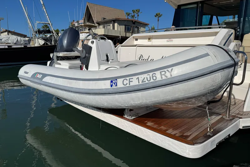 Slide: The Image of Inflatable boat on 2016 Tiara Yachts 50 Coupe, docked at marina. - 36