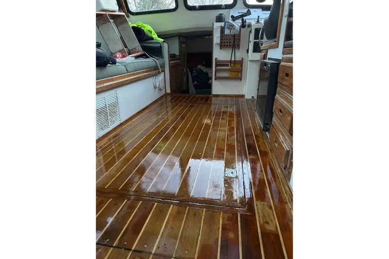 Slide: The Image of Interior of 1998 Eastern JC Casco Bay boat with polished wooden flooring. - 6
