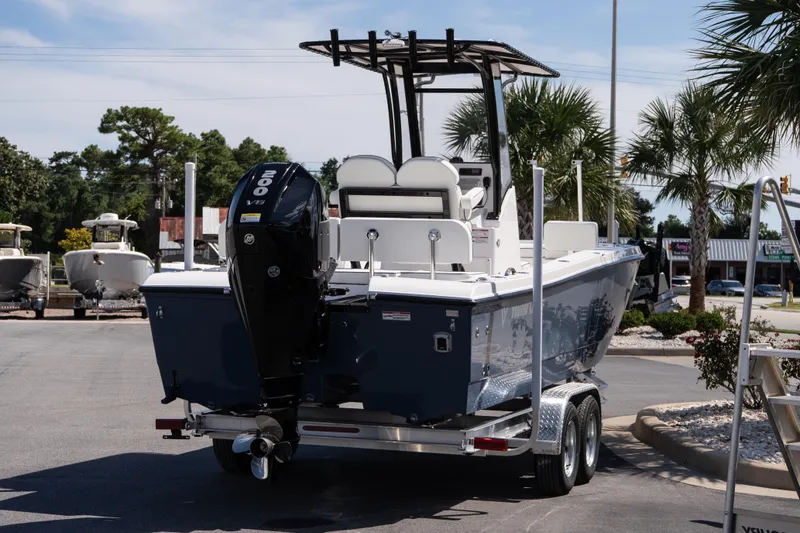Slide: The Image of 2026 Twin Vee 22 Baycat boat on trailer, featuring powerful 200 V6 engine. - 9