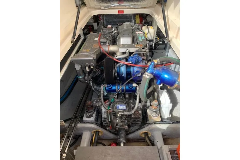 Slide: The Image of Engine compartment of a 2004 Mainship Pilot 30-II boat, showcasing mechanical components. - 20