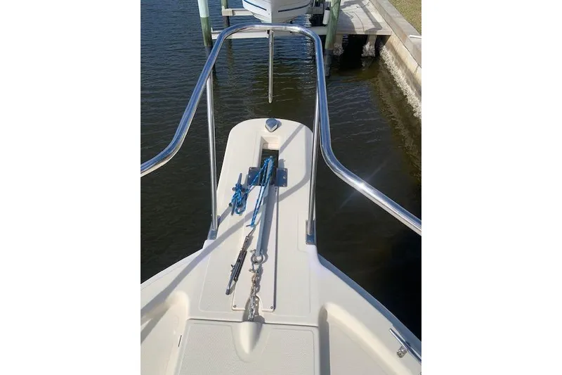 Slide: The Image of 2004 Mainship Pilot 30-II boat bow with anchor and railing. - 4
