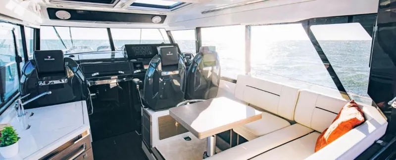 Slide: The Image of Interior of 2025 Wellcraft 38 Explorer boat with modern seating and helm. - 5