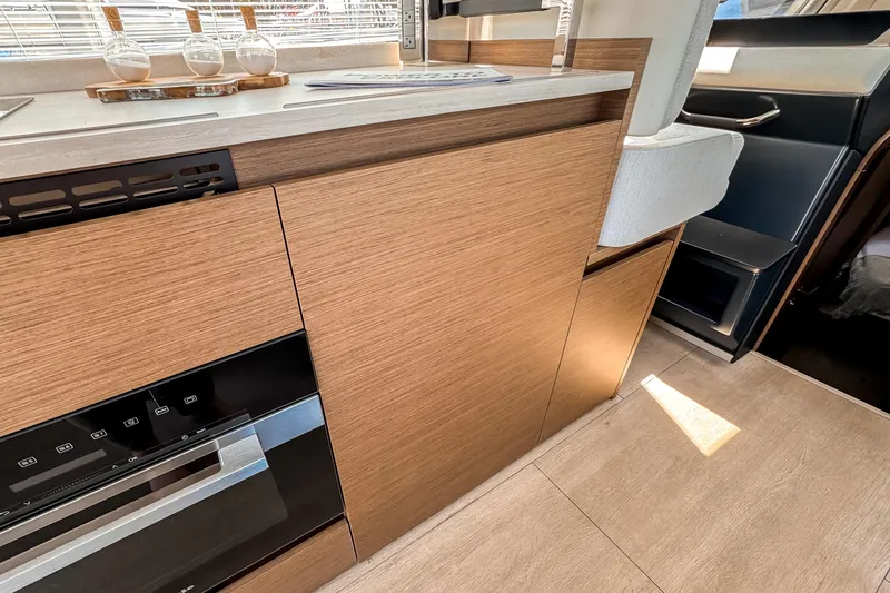 Slide: The Image of Interior of Wellcraft 44 Explorer 2026 with modern wood finish. - 11