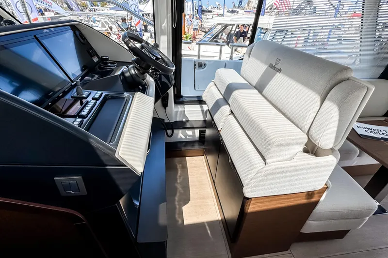 Slide: The Image of Interior of 2026 Wellcraft 44 Explorer with modern helm console. - 15