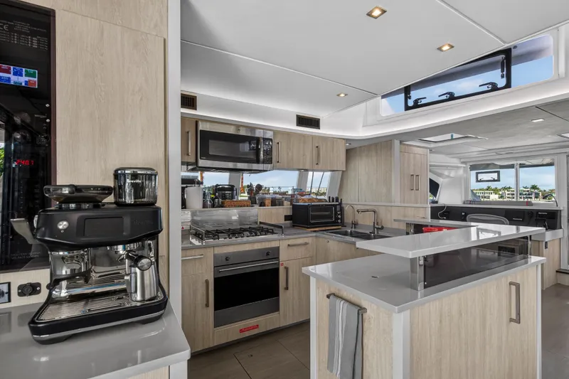 Slide: The Image of Luxurious kitchen interior of 2019 Leopard 58 yacht with modern appliances and sleek design. - 10