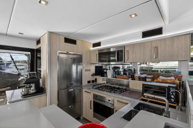 Slide: The Image of Modern kitchen interior on 2019 Leopard 58 yacht with stainless steel appliances. - 11