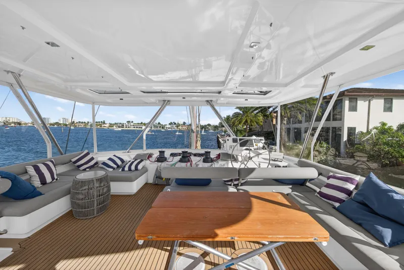 Slide: The Image of Luxurious 2019 Leopard 58 yacht interior with spacious seating and scenic waterfront view. - 19