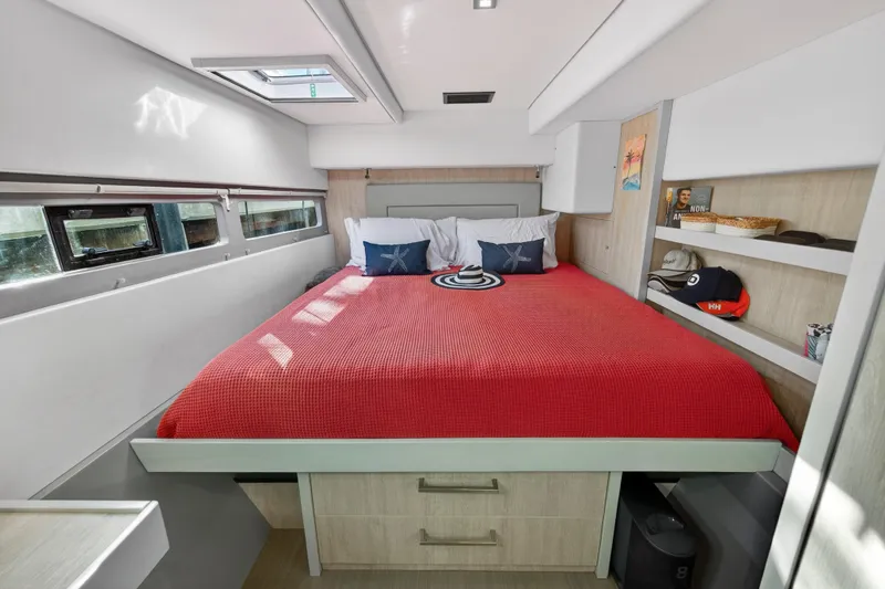 Slide: The Image of Luxurious bedroom interior of 2019 Leopard 58 yacht with red bedding and modern decor. - 27