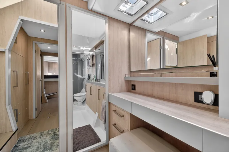 Slide: The Image of Luxurious 2019 Leopard 58 yacht interior with modern bathroom and vanity area. - 29