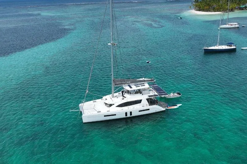 Slide: The Image of Aerial view of 2019 Leopard 58 yacht on turquoise waters near a tropical island. - 3