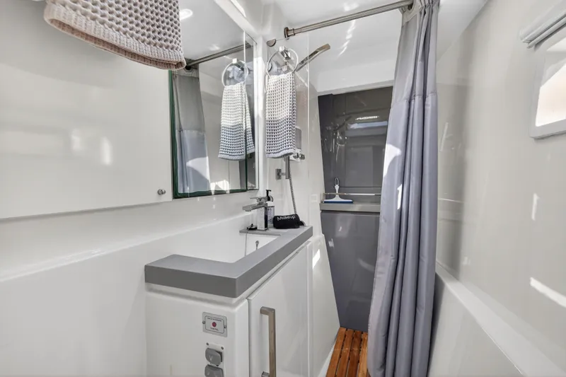 Slide: The Image of Modern bathroom interior on 2019 Leopard 58 yacht, featuring sleek design and elegant fixtures. - 32