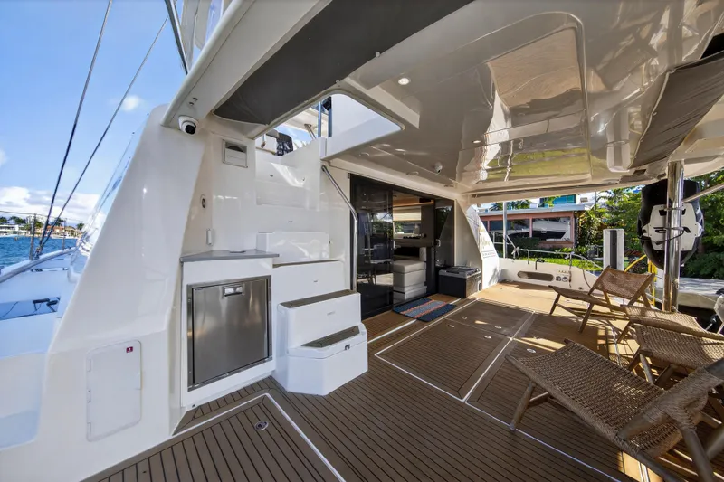 Slide: The Image of Luxurious 2019 Leopard 58 yacht deck with seating, modern amenities, and ocean view. - 5