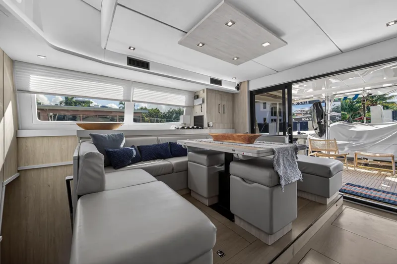 Slide: The Image of Luxurious interior of 2019 Leopard 58 yacht with modern seating and large windows. - 8