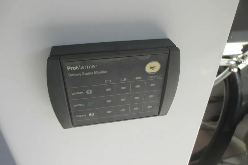 Slide: The Image of 2019 Sailfish 325 DC boat interior with beige seating and steering wheel. - 14