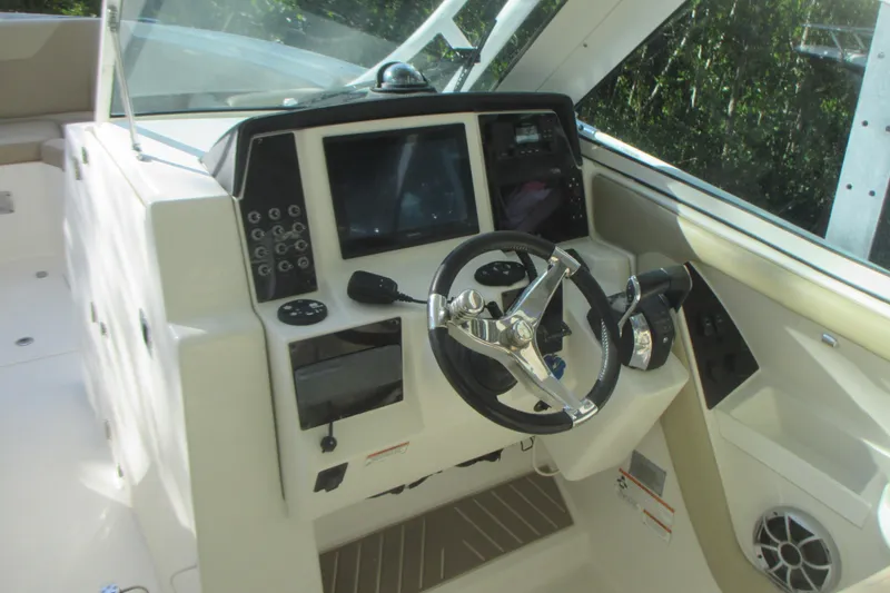 Slide: The Image of 2019 Sailfish 325 DC boat seat with beige upholstery and modern design. - 16
