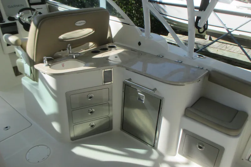 Slide: The Image of 2019 Sailfish 325 DC boat interior roof with speakers and natural light. - 20