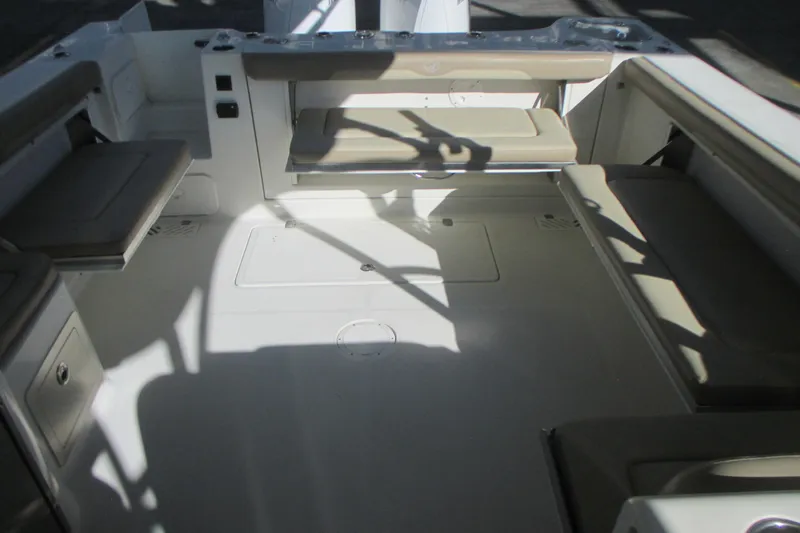 Slide: The Image of 2019 Sailfish 325 DC boat with retractable sunshade in storage facility. - 21