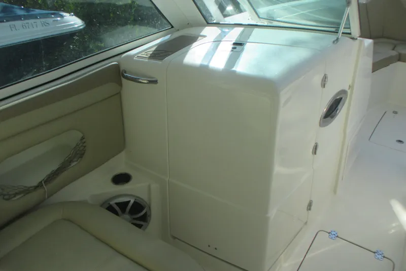 Slide: The Image of 2019 Sailfish 325 DC boat with twin 300 V8 engines, docked outdoors. - 9