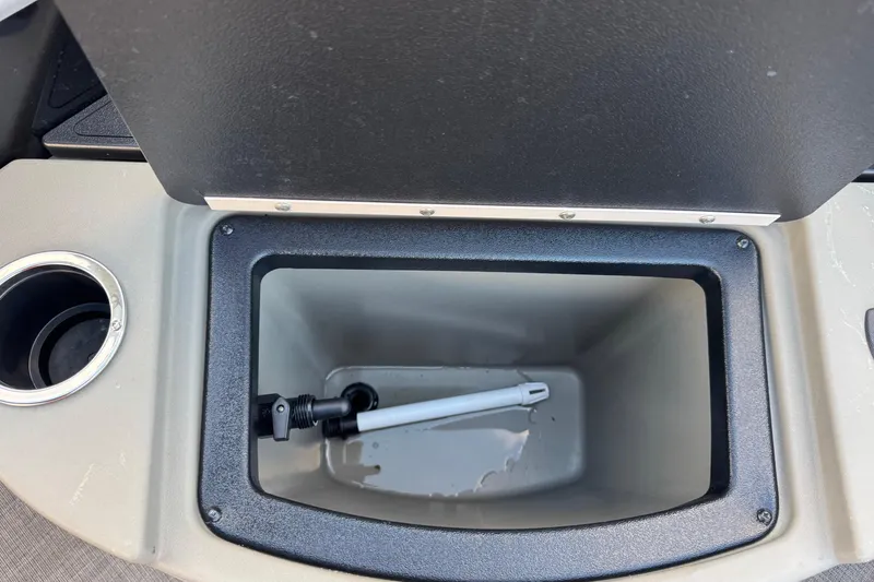 Slide: The Image of 2024 Sun Tracker SportFish 20 DLX livewell with cup holder, open lid view. - 17