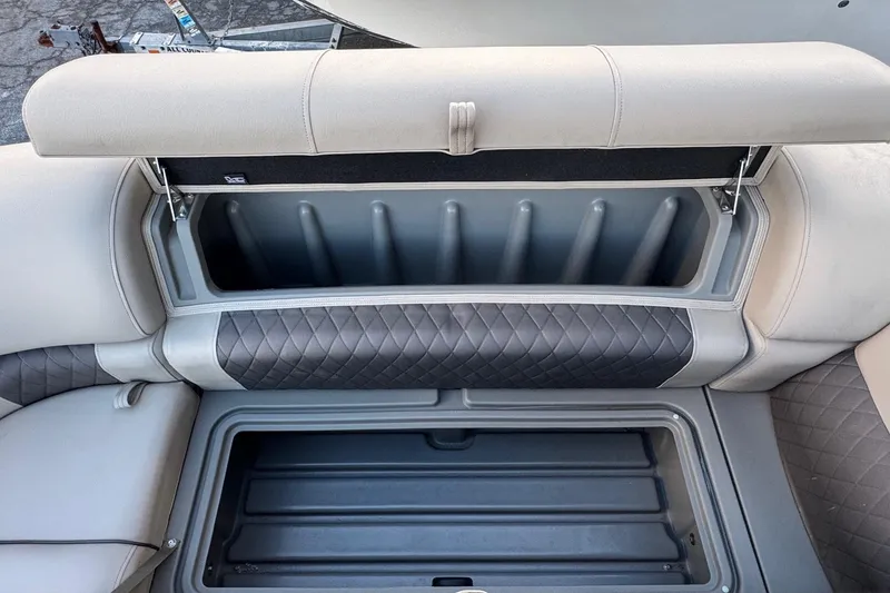 Slide: The Image of 2024 Sun Tracker SportFish 20 DLX boat storage compartments with quilted upholstery. - 22