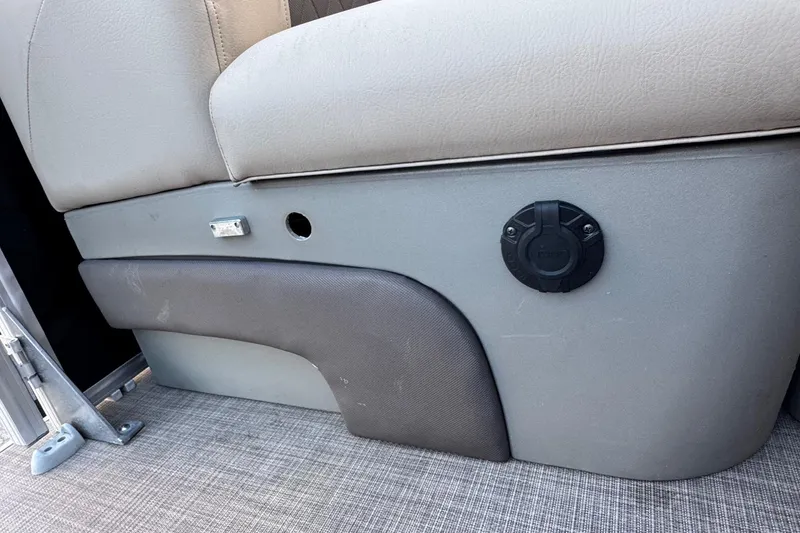 Slide: The Image of 2024 Sun Tracker SportFish 20 DLX boat seat detail with plug socket. - 25