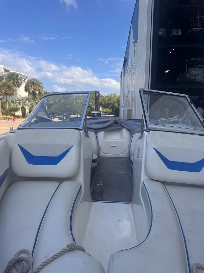 Slide: The Image of Interior of a 2006 Bayliner 185 boat with blue accents. - 3