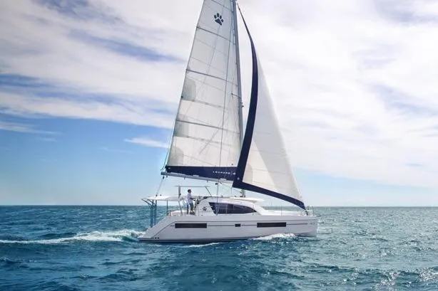 The Image of 2018 Leopard 40 catamaran sailing on open sea under clear skies. - 0