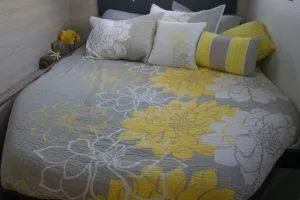 Slide: The Image of Cozy bed with blue striped bedding in a 2018 Leopard 40 yacht cabin. - 16