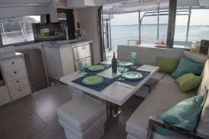 Slide: The Image of Modern interior of 2018 Leopard 40 catamaran with dining setup and kitchen area. - 18