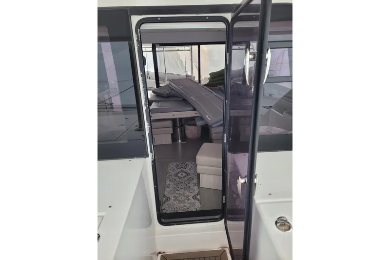 Slide: The Image of Interior view of a 2018 Leopard 40 catamaran, showcasing seating and decor. - 26
