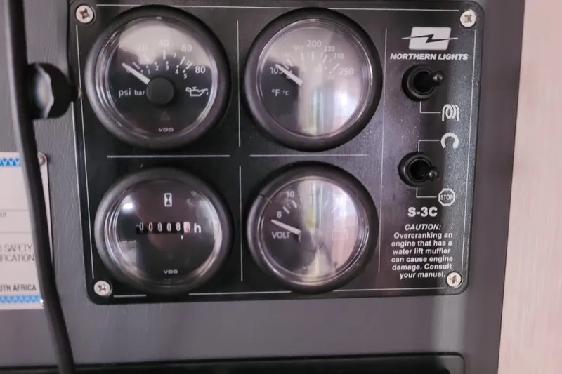 Slide: The Image of Control panel of a 2018 Leopard 40 with gauges and Northern Lights S-3C switches. - 31