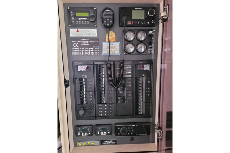 Slide: The Image of Electrical control panel of a 2018 Leopard 40 yacht with various instruments and switches. - 32