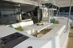 Slide: The Image of 2018 Leopard 40 yacht interior with modern seating and dining area. - 4