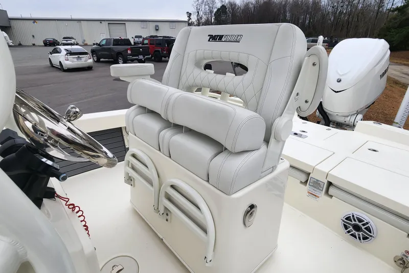 Slide: The Image of 2024 Pathfinder 2600 TRS boat interior with luxury seating and steering wheel. - 14