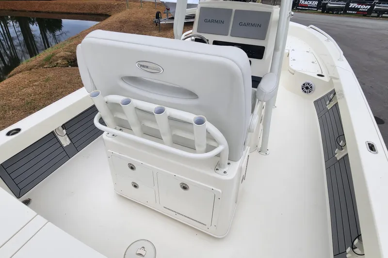 Slide: The Image of 2024 Pathfinder 2600 TRS boat interior with Garmin displays and rod holders. - 15