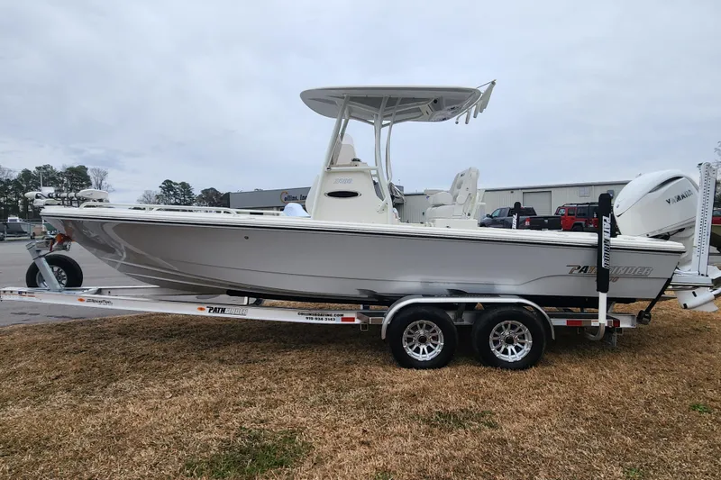 Slide: The Image of 2024 Pathfinder 2600 TRS boat on trailer, side view, outdoors. - 6
