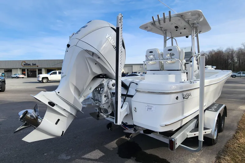 Slide: The Image of 2025 BlackJack 256 Coastal boat with Yamaha outboard motor on a trailer. - 4