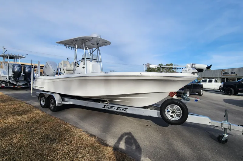 Slide: The Image of 2025 BlackJack 256 Coastal boat on Sport Trail trailer, parked outdoors. - 8