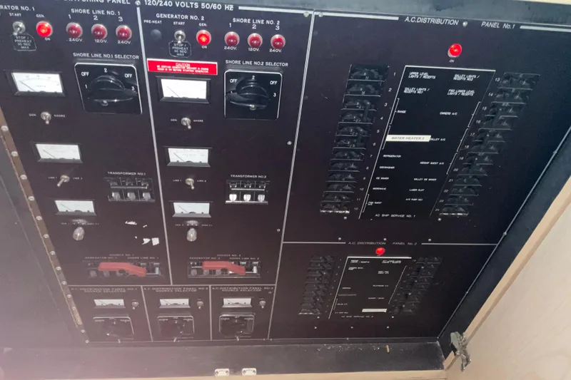 Slide: The Image of Electrical control panel of a 1997 Hatteras 70 Sport Deck Motor Yacht. - 19