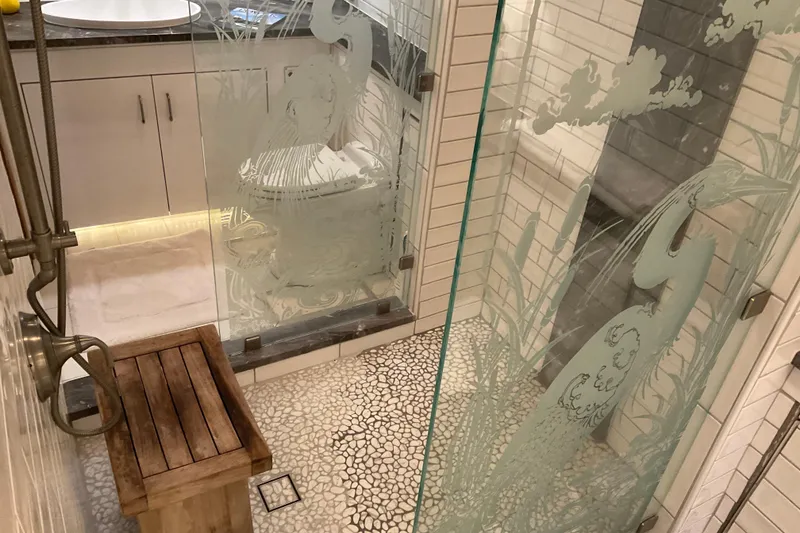 Slide: The Image of Luxurious bathroom in 1997 Hatteras 70 Sport Deck Motor Yacht with etched glass shower. - 28