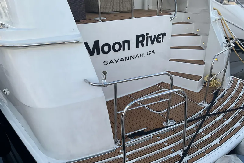 Slide: The Image of 1997 Hatteras 70 Sport Deck Motor Yacht, "Moon River," docked in Savannah, GA. - 3