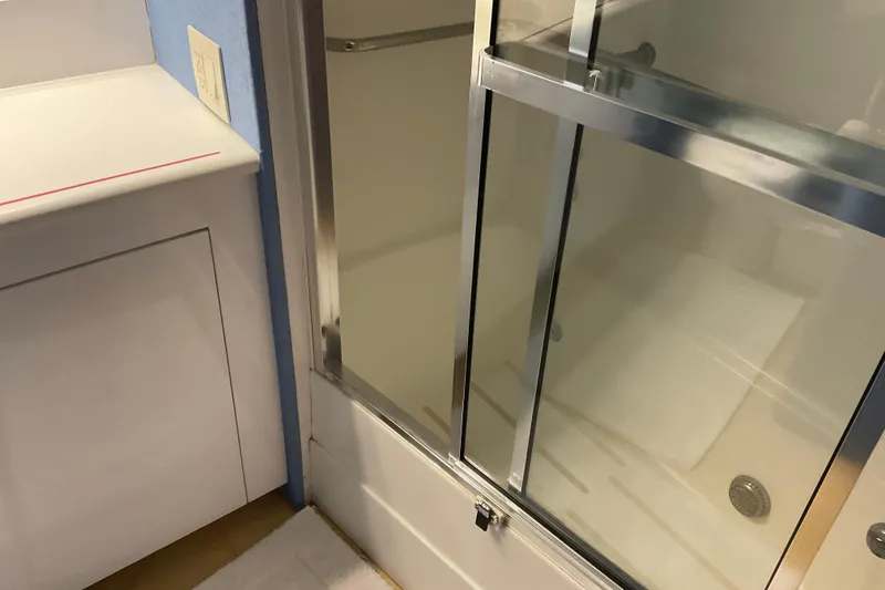 Slide: The Image of Shower area in 1997 Hatteras 70 Sport Deck Motor Yacht bathroom. - 32